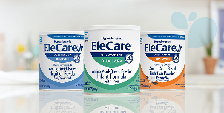 Cans of EleCare Jr Unflavored, EleCare Infant Formula, and EleCare Jr Vanilla sitting on a kitchen counter.